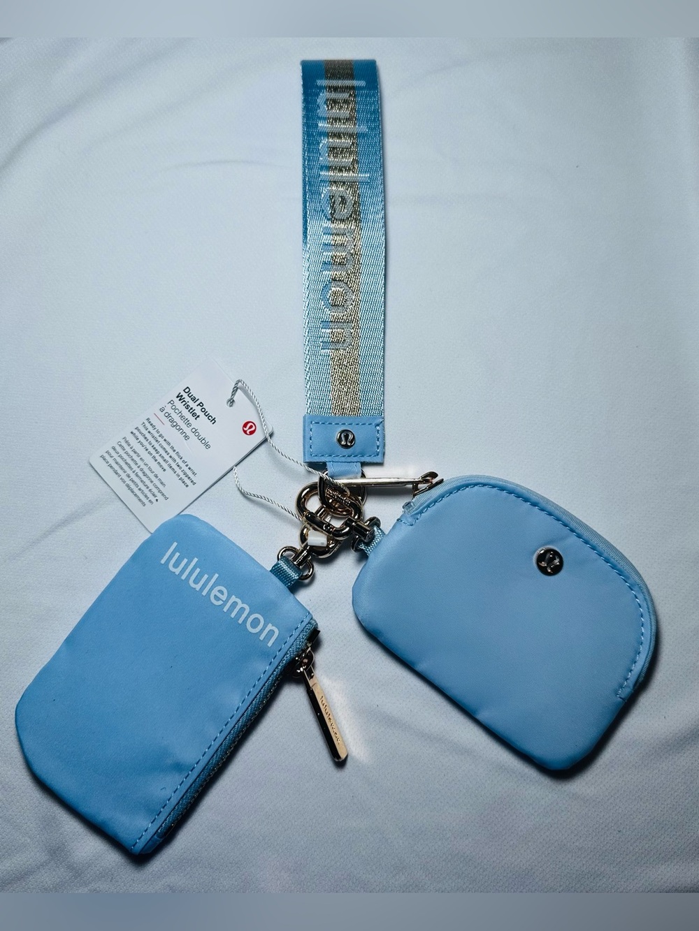 lululemon light blue dual pouch wristlet with gold hardware